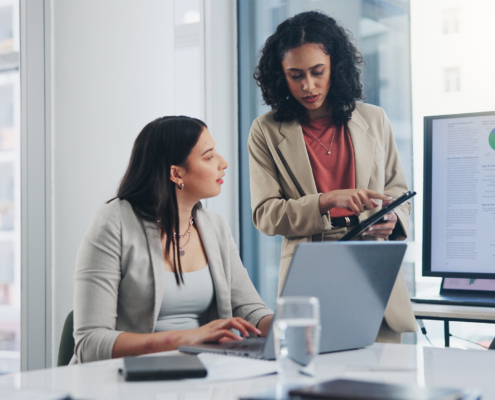 Business meeting, data analytics or women with graph presentation in office for tablet